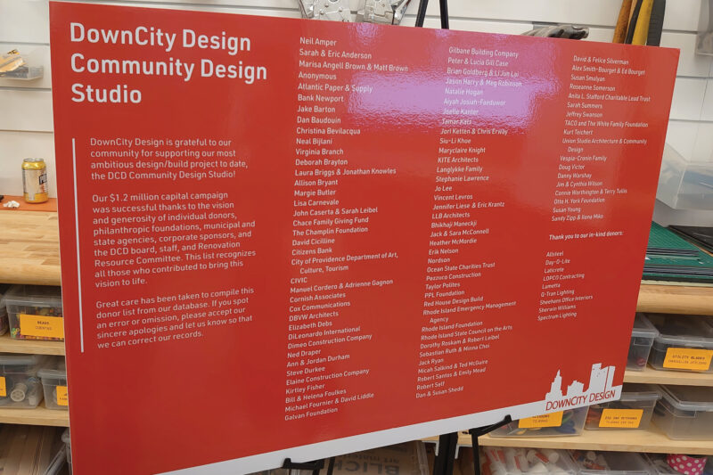 Sign displaying sponsor logos, including Lumetta, supporting DownCity Design’s community-focused event.